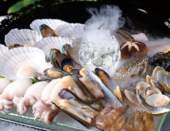 A dramatic seafood platter — scallops, mussels, squid and shrimp